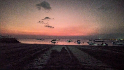 The view of the sunset in Nusa Penida is very beautiful and enchanting with an orange sky