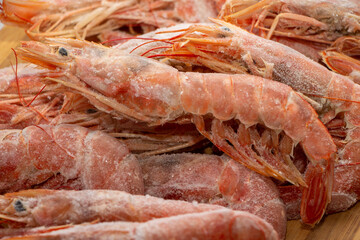 Raw wild Argentinian red shrimps/prawns and ingredients for cooking. Delicious food. Keto / Paleo Diet.