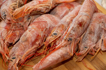 Raw wild Argentinian red shrimps/prawns and ingredients for cooking. Delicious food. Keto / Paleo Diet.