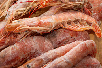 Raw wild Argentinian red shrimps/prawns and ingredients for cooking. Delicious food. Keto / Paleo Diet.