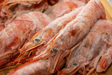 Raw wild Argentinian red shrimps/prawns and ingredients for cooking. Delicious food. Keto / Paleo Diet.