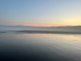 Fototapeta premium Misty Sunrise on Cannon Beach in the morning.