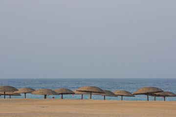 lot of parasol on the sandy beach at the red sea