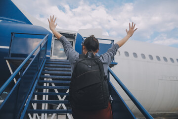 Happy attractive asian woman traveler with backpack at the modern airport terminal, copy space,...