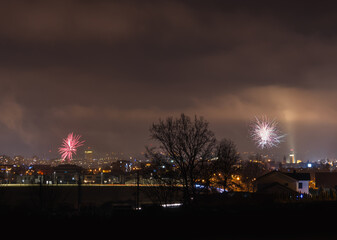 New year fireworks above city Ceske Budejovice, Czech republic. Night pyrotechnic celebration