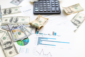 Accounting charts and graphs with us dollar bills pen calculator. Stock market graphs