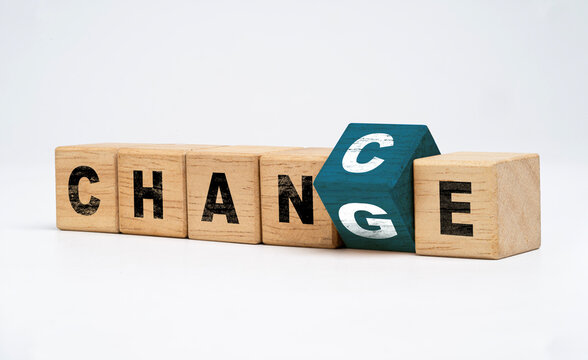 Flipping of wooden block cube to adjust between change wording to chance wording for growth attitude and positive mindset of personal development concept.