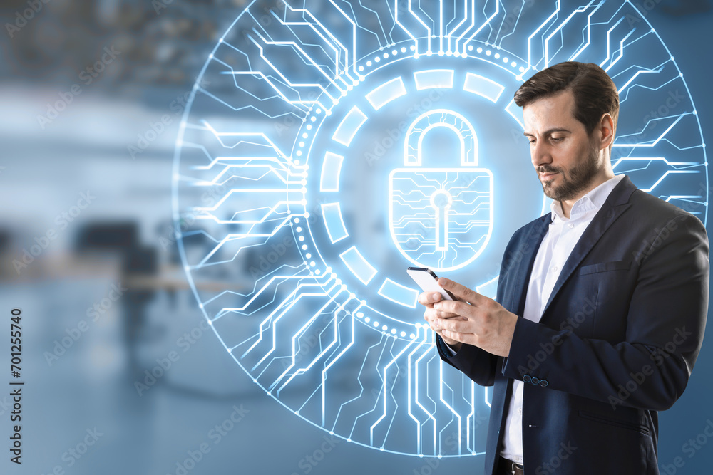 Poster young businessman using mobile phone with creative glowing round padlock hologram with circuit on bl