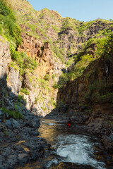 A hiker on the Ngare Sero River trail in Ngare Sero River in Tanzania 