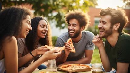 Möbelaufkleber Cheerful multiracial friends having fun eating in pizzeria. © Irina
