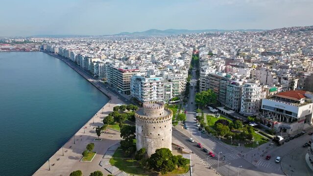 Aerial View of Landmark Ottoman Fortress White Tower of Thessaloniki. Waterfront of the city of Thessaloniki, Whitewashed Tower, Greek port city with tall buildings in Greece.
