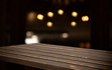image of a wooden table on a blurred bokeh background