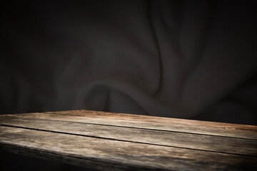 wooden table on an abstract dark background