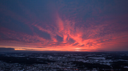 Afterglow over Dramatic Sky at Sunrise. Colorful sky at dawn with a serene and scenic landscape. Cityscape at Sunset with Beautiful Sky and Urban Landscape