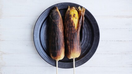 Nice smell Corn grill on charcoal stove Ripe yellow corn is grilled. BBQ and grill