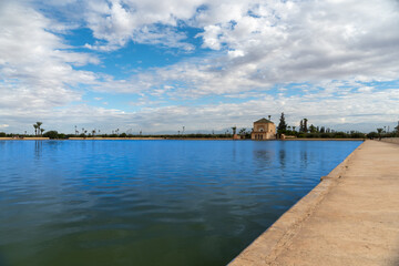 Photo of the Menara Gardens in the city of Marrakech. Photo of the lake with the house at the end...
