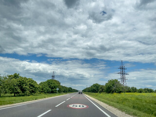 Fototapeta premium Straight road and cloudy sky in Moldova