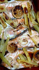 Red fish with potato, lemon and onion 