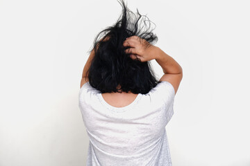 Back view: A woman ruffled her hair