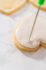 Heart-shaped sugar cookies with royal icing