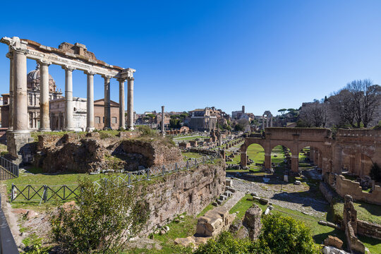 Rome, Italy - February 23, 2023: Wide angle shot of the Roman Forum depicting the Temple of Saturn and the Basilica Julia in Rome, Italy, as seen from the west side