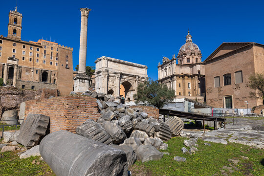 Rome, Italy - February 23, 2023: Wide angle shot of the Roman Forum depicting the Arch of Septimius Severus and the Column of Phocas in Rome, Italy