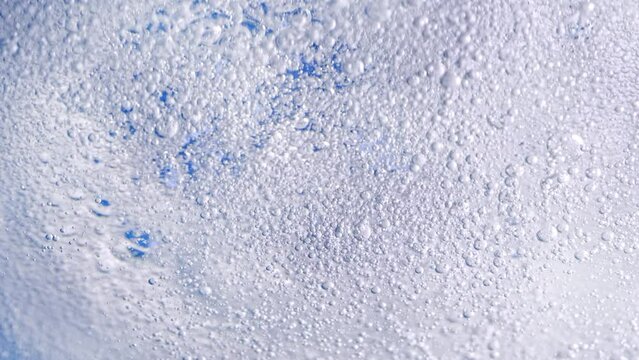 Super Slow Motion Shot of Bubbling Light Blue Background at 1000fps.