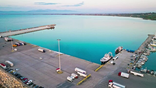 Aerial view of a golden sunset over Port Killini, ferry service in Kyllini. The largest port in the Ionian Sea and the third in Greece, the port connects the mainland with Zakynthos and Kefalonia.