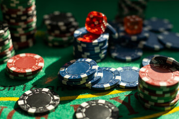 Colored poker chips on green table