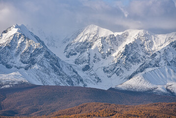 Fototapeta na wymiar Mountains covered with snow during sunrise. Mountain landscape.