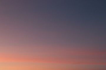 Morning star on the sky, soft pastel orange, pink and blue colors. Pink sky with early morning light.