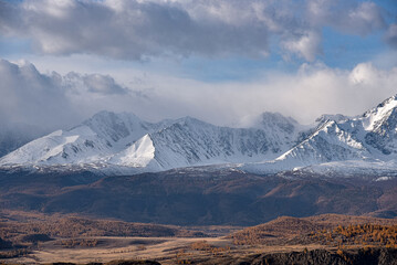 Mountains covered with snow during sunrise. Mountain landscape.