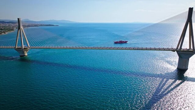 Aerial view of Charilaos Trikoupis Rio-Antirrio Bridge, the world's longest multi-span cable-stayed bridges. The longest of the fully suspended type crosses the Gulf of Corinth, Patras with ferries.