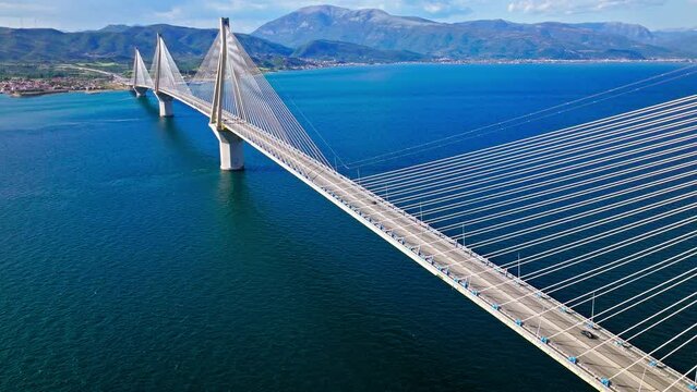 Aerial view of Charilaos Trikoupis Rio-Antirrio Bridge, the world's longest multi-span cable-stayed bridges. The longest of the fully suspended type crosses the Gulf of Corinth, Patras with ferries.