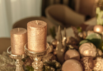 golden traditional unlit candles and festive decorations for Christmas or new year