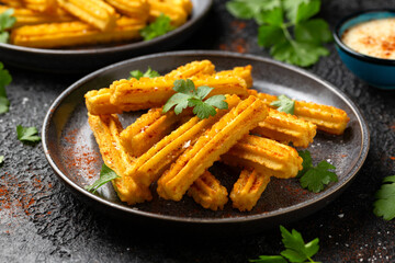 Crisp and golden Potato churros served with paprika and fresh parsley