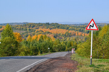 Autumn landscape. Autumn road with sharp turns.