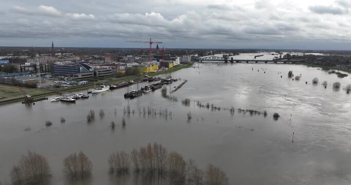 Flooding of the Ijssel river. High water and water damage.