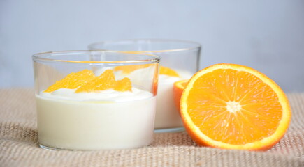 Orange cream, dessert, delicious fruity cream with oranges in a glass, isolated, dessert winter