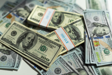 Big pile of US money lying down in random order closeup