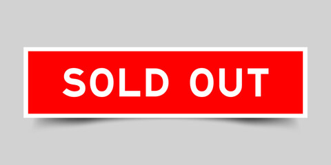 Square sticker label with word sold out in red color on gray background