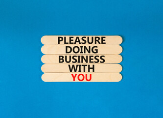 Pleasure doing business with you symbol. Concept words Pleasure doing business with you on wooden stick. Beautiful blue table blue background. Pleasure doing business with you concept. Copy space.