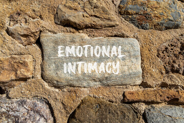 Emotional intimacy symbol. Concept words Emotional intimacy on beautiful grey stone. Beautiful brown stone wall background. Psychology emotional intimacy concept. Copy space.