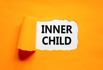 Inner child symbol. Concept words Inner child on beautiful white paper. Beautiful orange table...