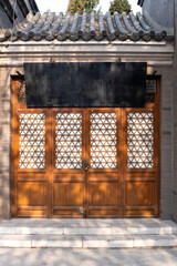 chinese traditional style wooden door and brick stone wall