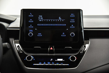 Car multimedia system with buttons.