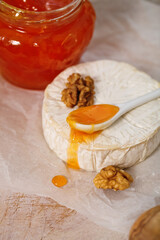 Cheese platter with nuts and jam