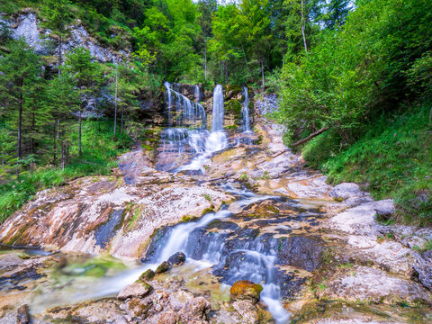 Berchtesgaden Weissach water fall long exposure embedded in green nature
