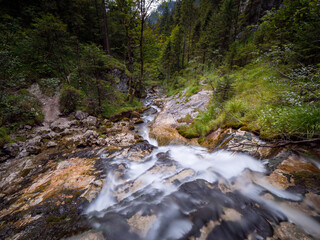Berchtesgaden Weissach water fall long exposure embedded in green nature