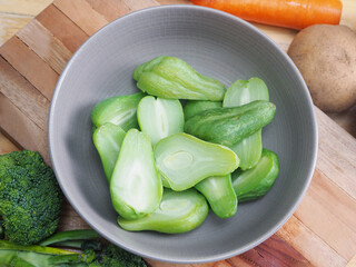 delicious green chayote in a ceramic bowl, full of nutrition such as vitamin and viber. Broccoli,...